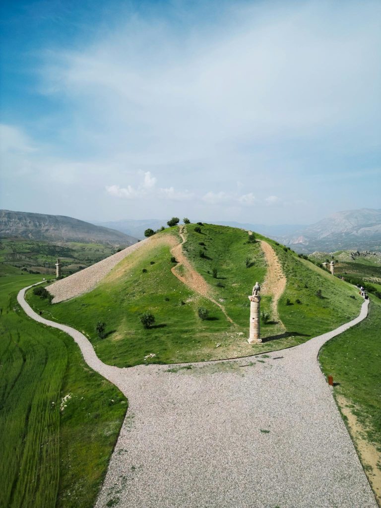 A scenic view of Karakus Tumulus with pathways in a rural Turkish landscape.